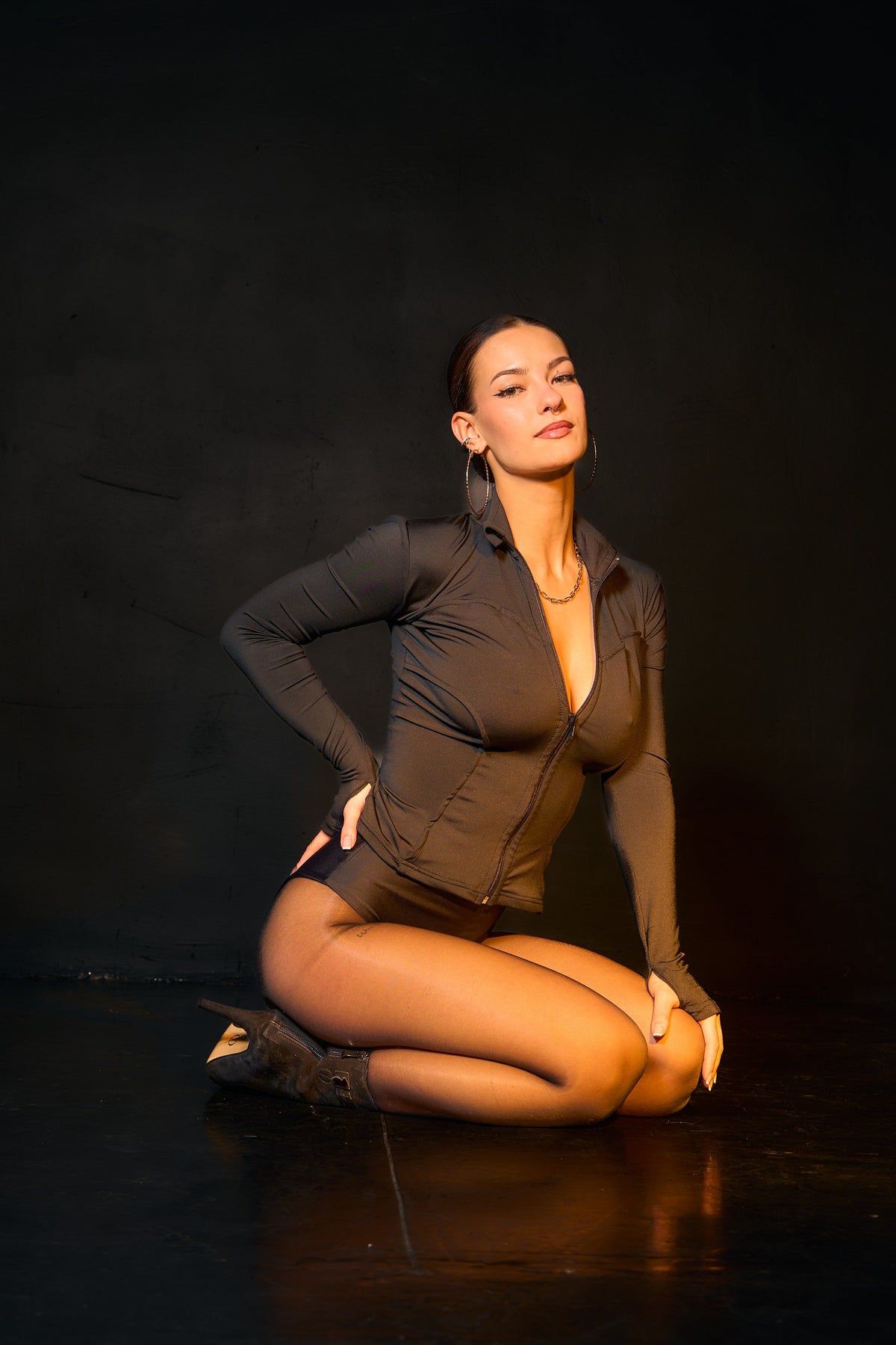 Nyx black tight-fitting zip-up sweatshirt